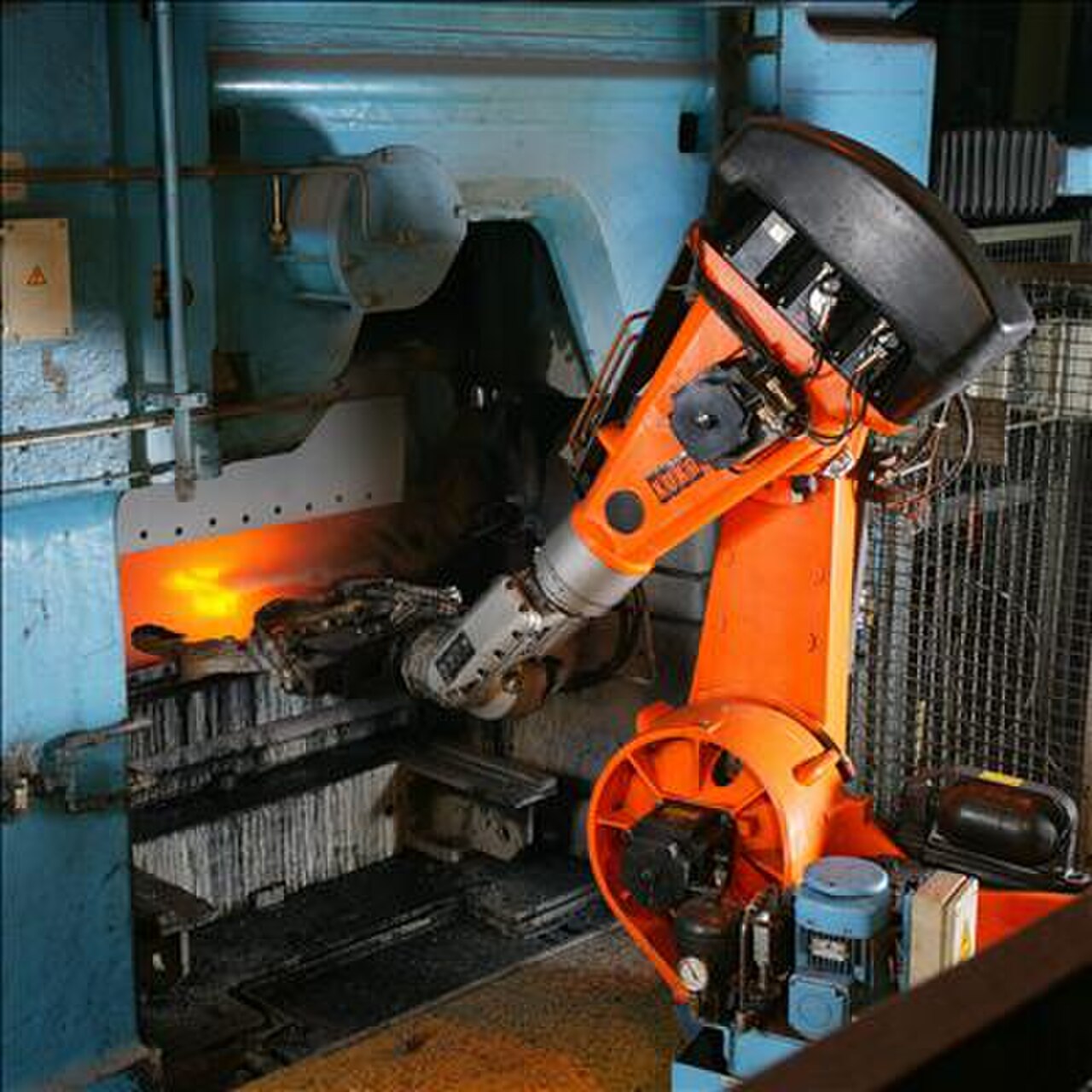 Industrial robotic arms automating a factory line — the kind of robotics SoftBank's Roze AI plans to deploy on AI data center construction